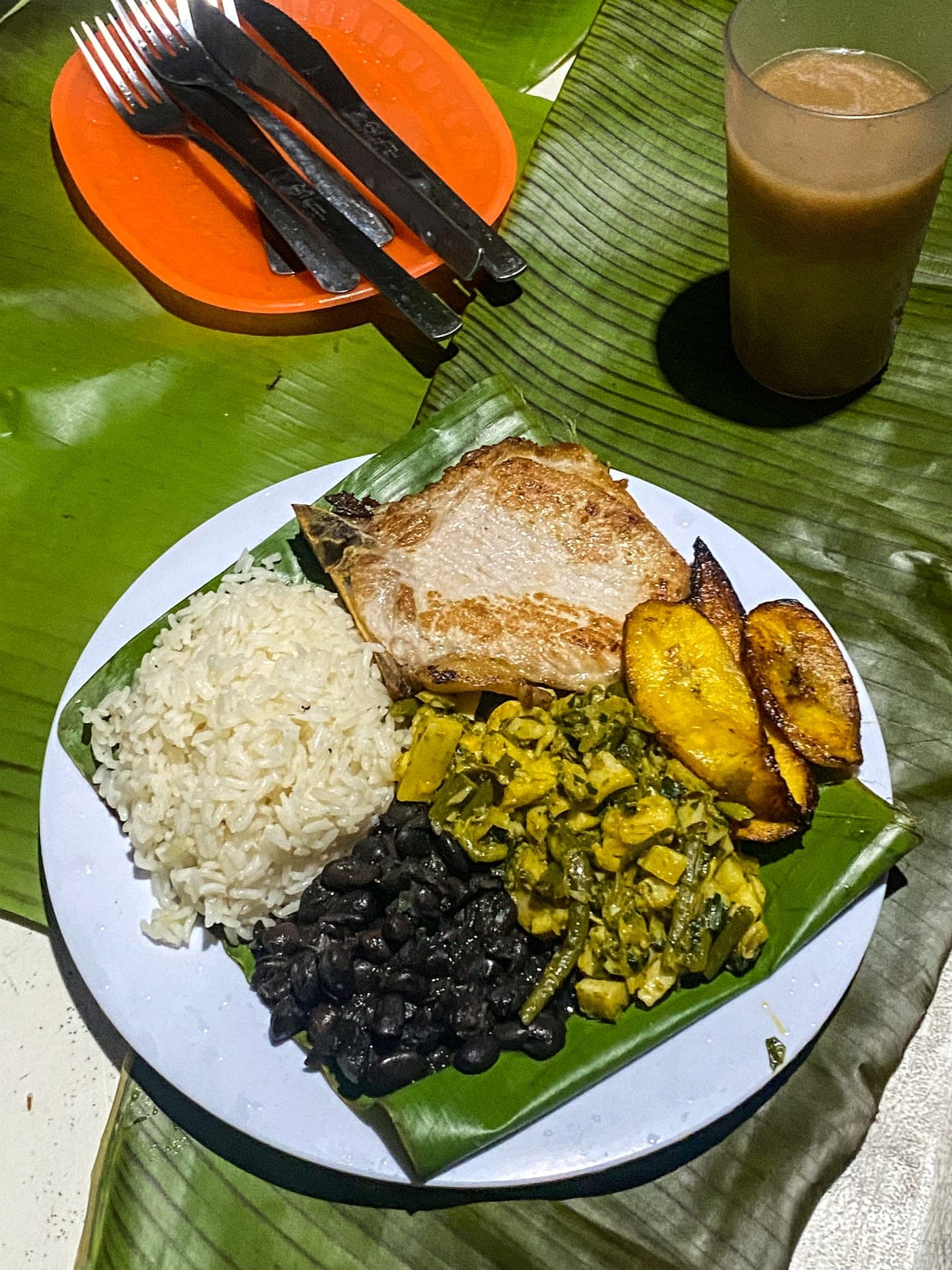 Traditional Costa Rican casado plate served on a banana leaf
